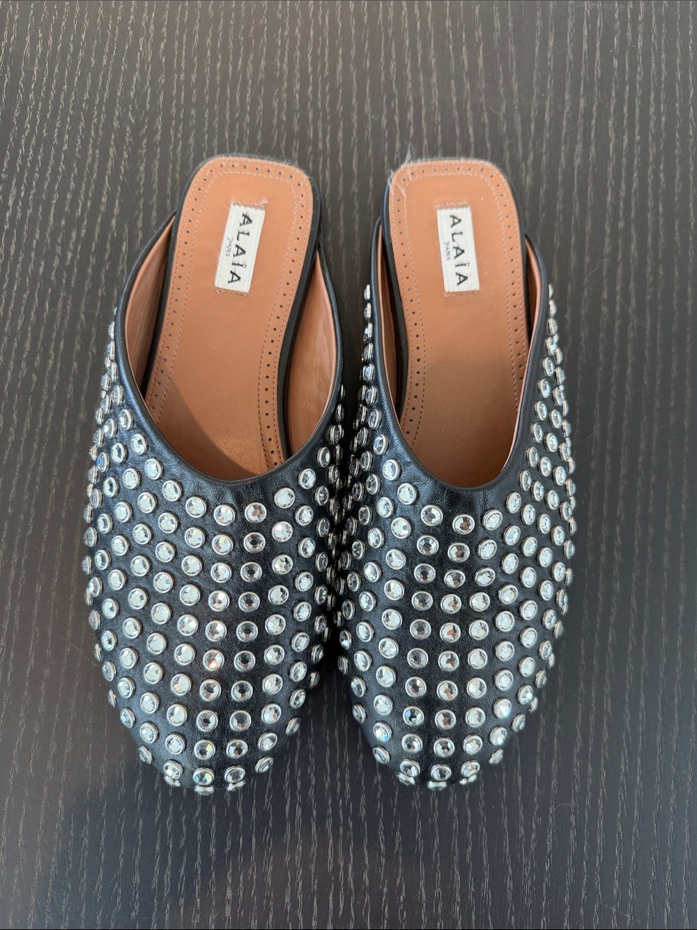 Alaia studded crystal mules in black leather
